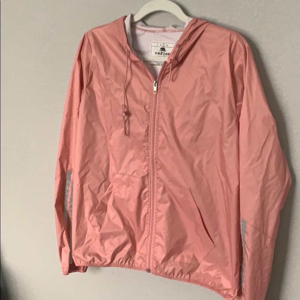 Lightweight windbreaker with reflective sleeves.